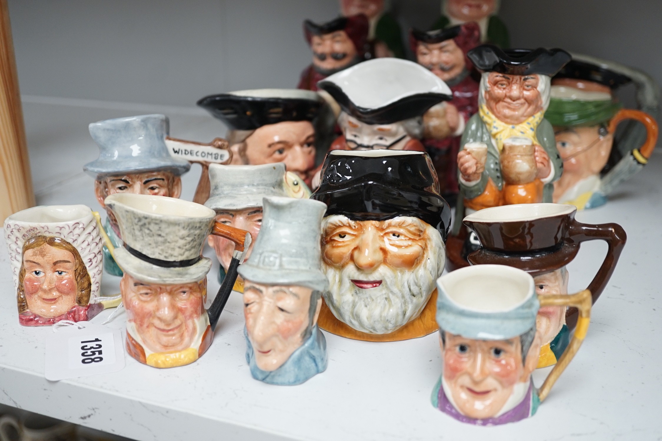Five Royal Doulton toby jugs and a collection of similar toby jugs